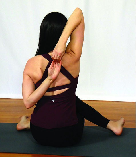 Watermarked preview of unlabeled image: Elbow Pronation: Yoga Cow Face Pose